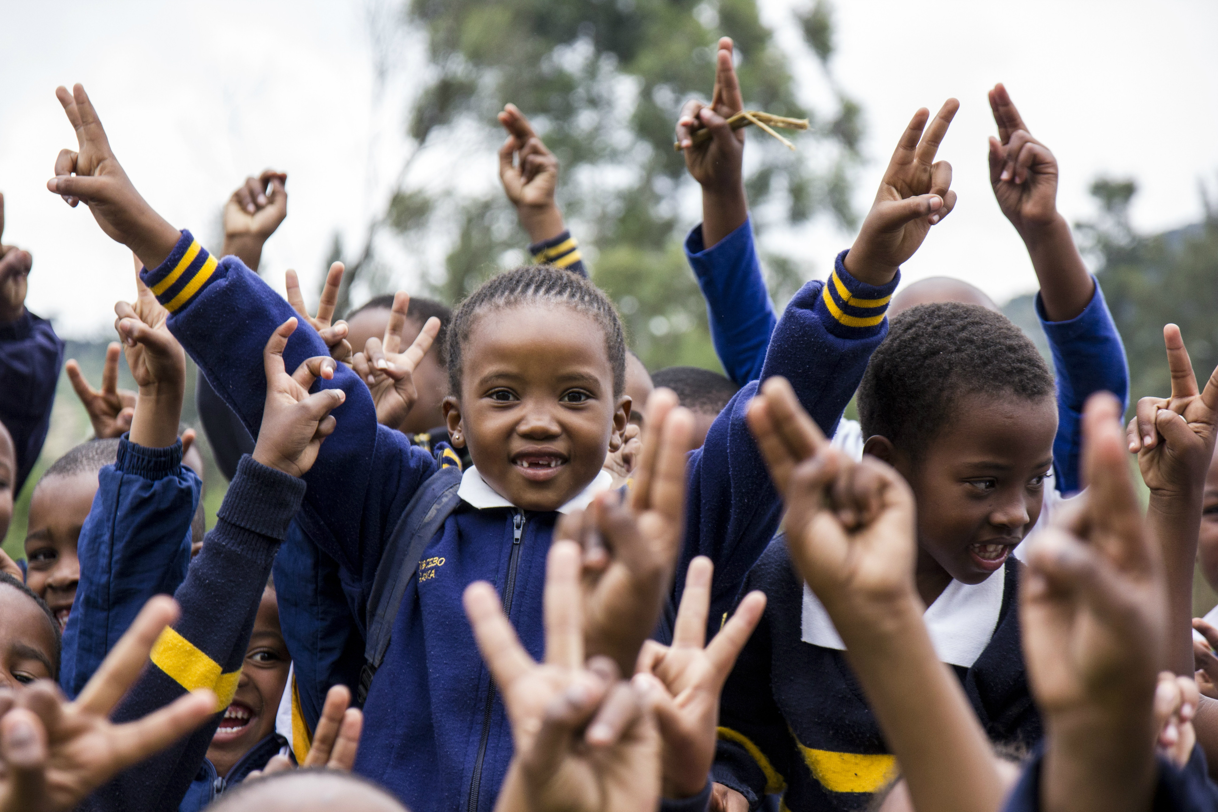 Glade skolebarn i barnebyen i Mbabane, Swaziland. Foto: Mats Hvalsengen