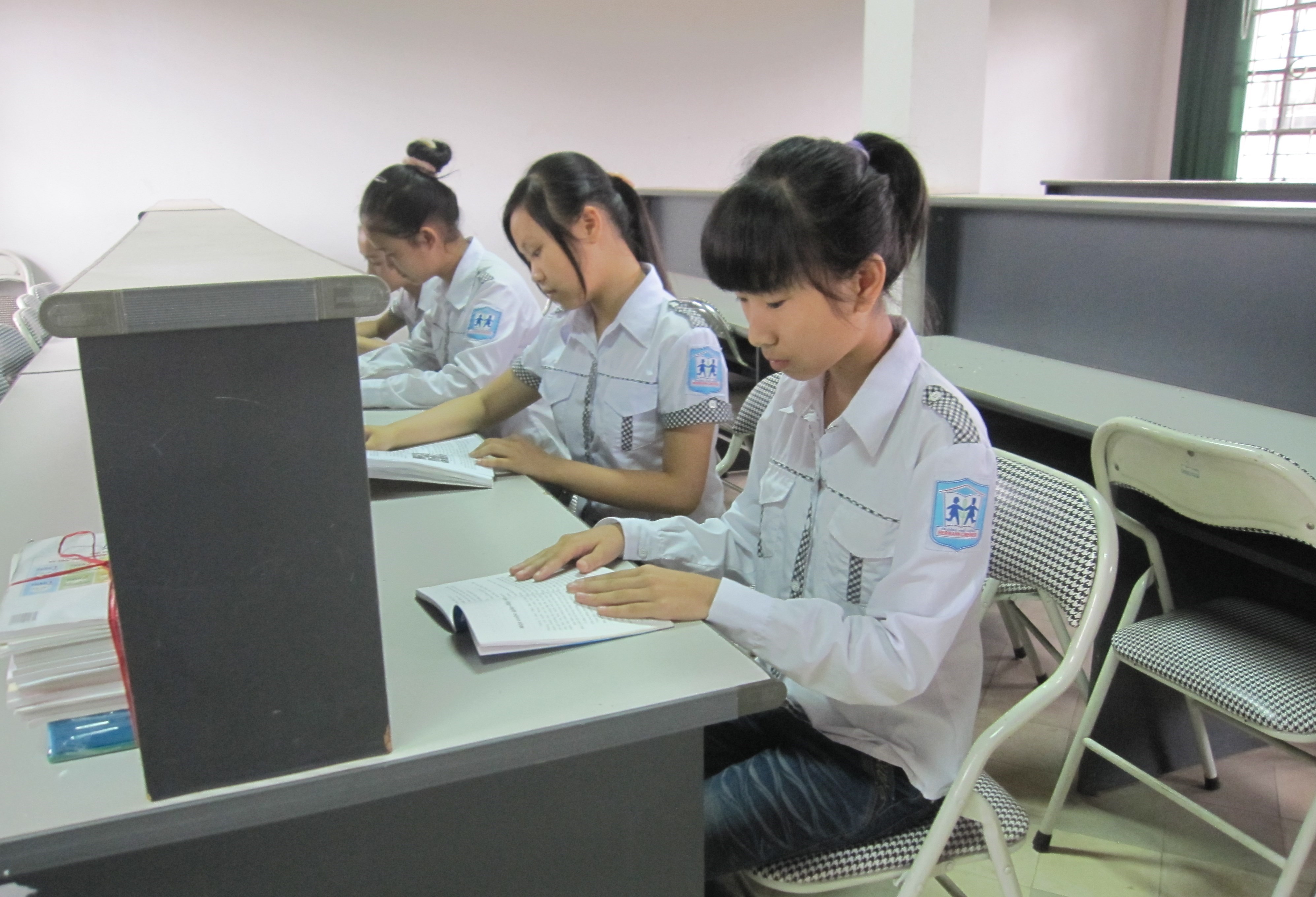 Kim and other students studying in a classroom at the SOS Hermann Gmeiner School in Viet Tri, Vietnam.      