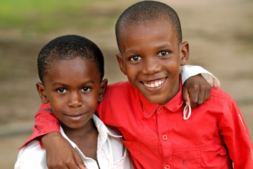 Two boys hugging each other SOS Children's Village Zanzibar, Tanzania. Photo: Katja Snozzi